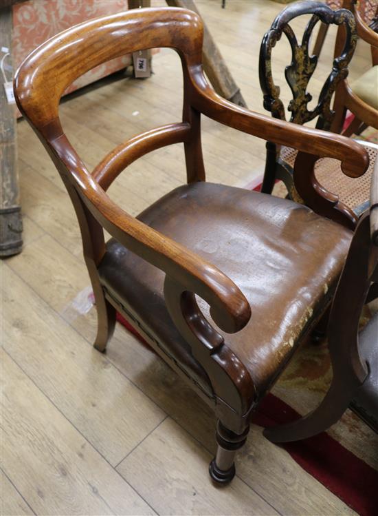 A mid Victorian mahogany open armchair, with openwork back, hide upholstered seat, on turned and tapering